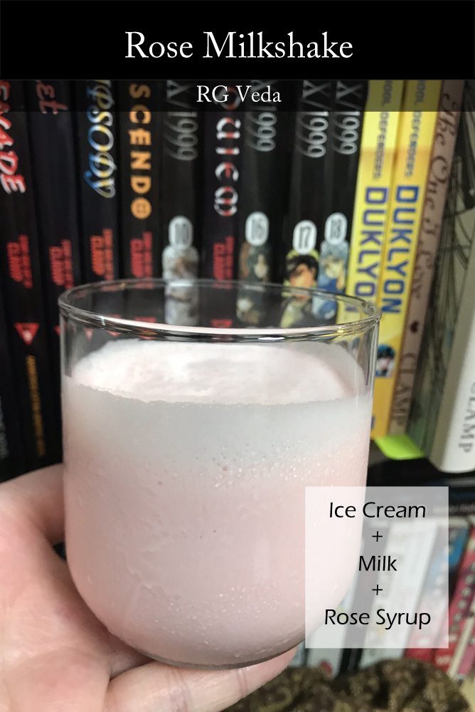 A small clear drinking glass filled with a pink milkshake. Behind it, many CLAMP comics are visible, just out of focus. Overlay text lists the drink's name and basic ingredients.