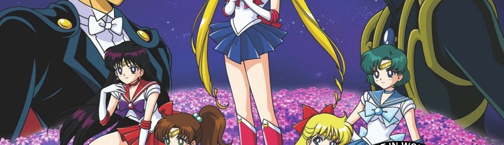 An image from the Sailor Moon R the Movie DVD cover. Tuxedo Mask and Fiore are staring each other down, with Sailor Moon and the Silver Crystal in the background, between them.