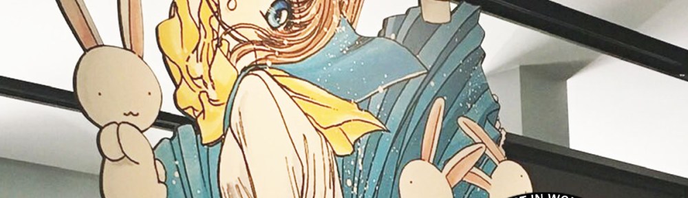 A photo of a display of Miyuki-chan in Wonderland at the British Museum, taken by Ian Wolf. CLAMPcast graphic is overlaid, along with the episode title: "Ep. 65: CLAMPdown | an interview with author Ian Wolf".